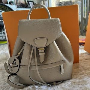 Louis Vuitton Monogram Empreinte Montsouris in Tourterelle (taupe)/pink interior